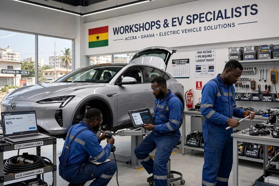 EV specialists in blue overalls servicing an electric car with a diagnostics tablet